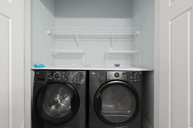 laundry area with washer and clothes dryer