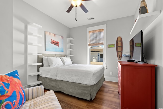 bedroom with hardwood / wood-style floors and ceiling fan