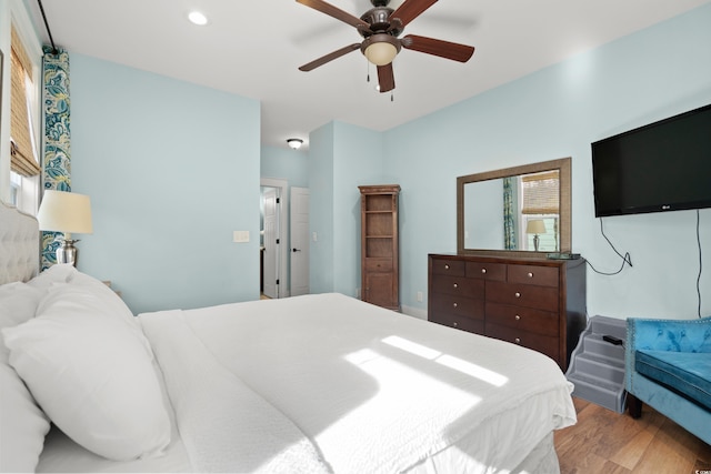 bedroom featuring hardwood / wood-style floors and ceiling fan