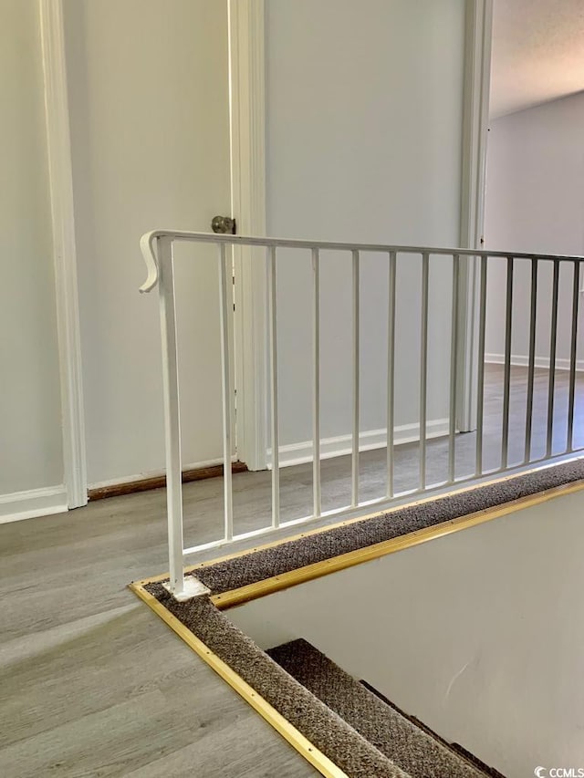 stairway featuring hardwood / wood-style floors