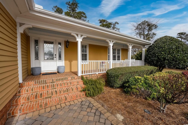 doorway to property featuring a porch