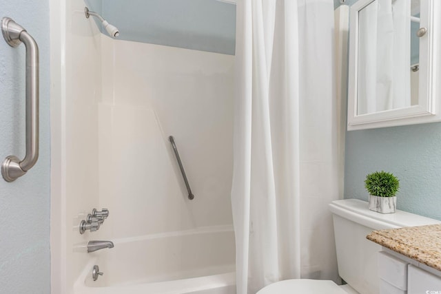 full bathroom with vanity, shower / bath combination with curtain, and toilet