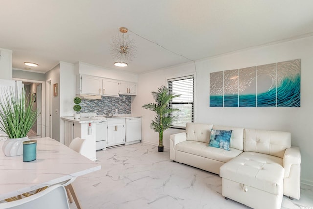 living room with crown molding and sink