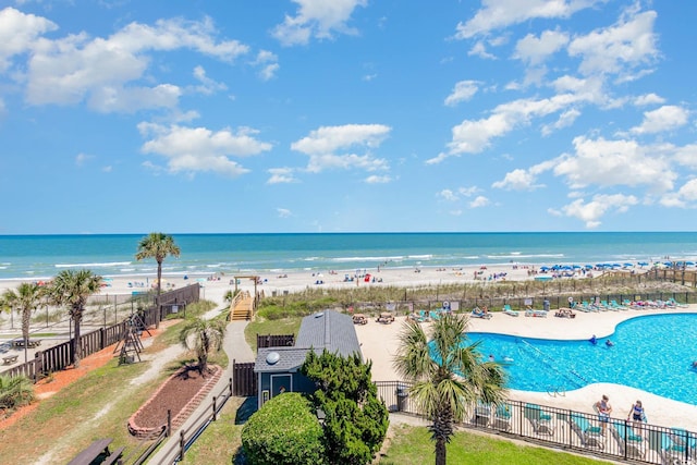 aerial view featuring a view of the beach and a water view