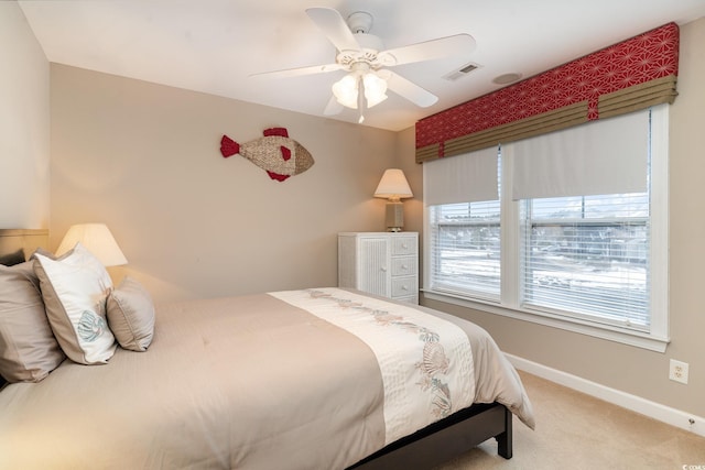 carpeted bedroom with ceiling fan