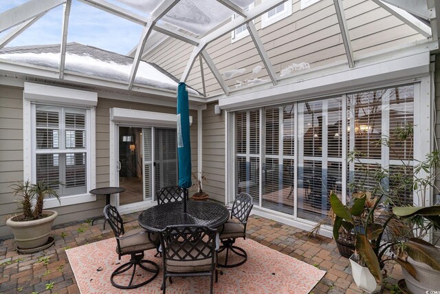 sunroom / solarium with lofted ceiling