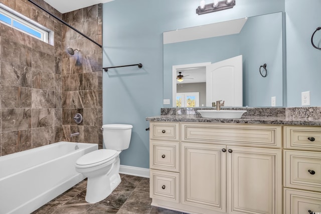 full bathroom with vanity, toilet, and tiled shower / bath