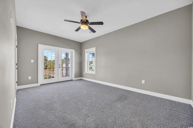 carpeted empty room with ceiling fan and french doors