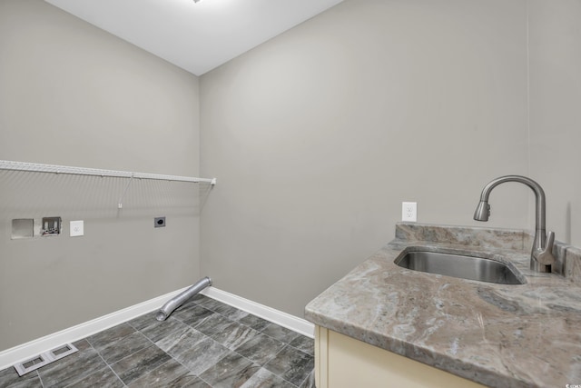 laundry area featuring cabinets, hookup for an electric dryer, hookup for a washing machine, and sink