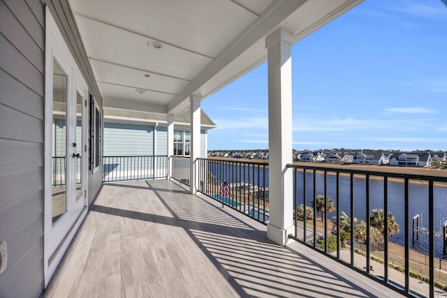 balcony featuring a water view