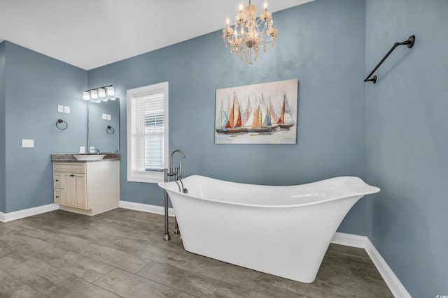 bathroom featuring a washtub and vanity