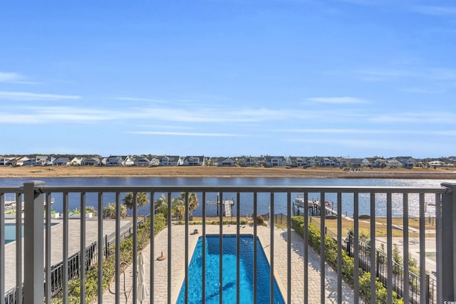 balcony with a patio and a water view