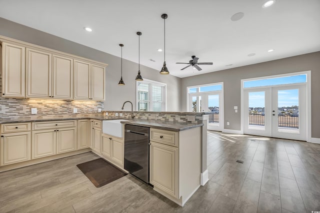 kitchen with dishwasher, french doors, cream cabinetry, decorative light fixtures, and kitchen peninsula