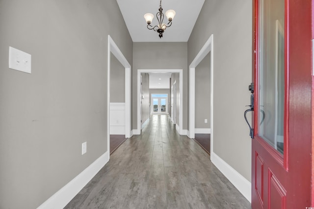 entrance foyer with a chandelier and light wood-type flooring