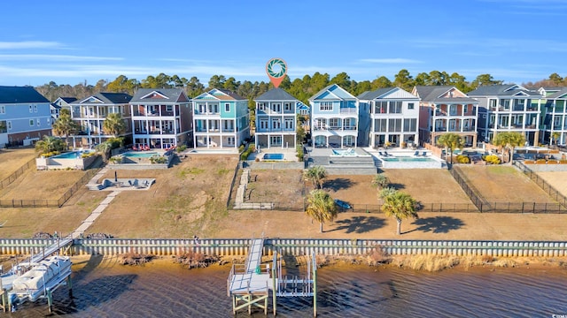 back of house featuring a water view