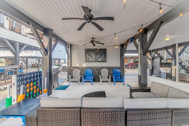 view of patio featuring ceiling fan and an outdoor living space