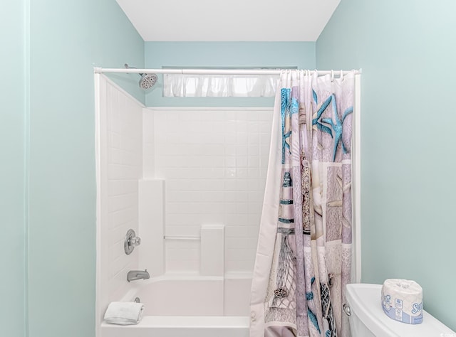 bathroom with toilet and shower / bath combo