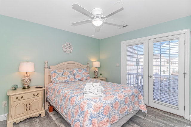 bedroom featuring ceiling fan, access to exterior, and hardwood / wood-style floors