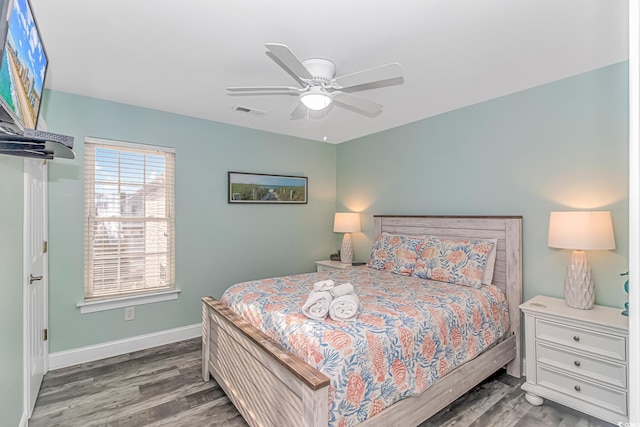 bedroom featuring dark hardwood / wood-style flooring and ceiling fan