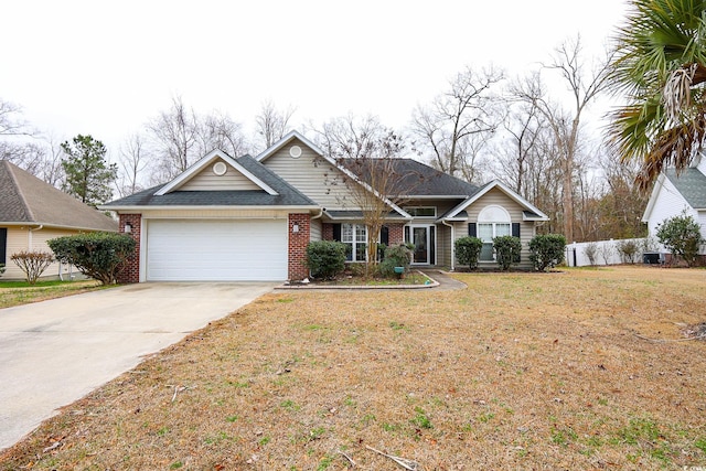 view of front of property featuring a garage, central air condition unit, and a front lawn