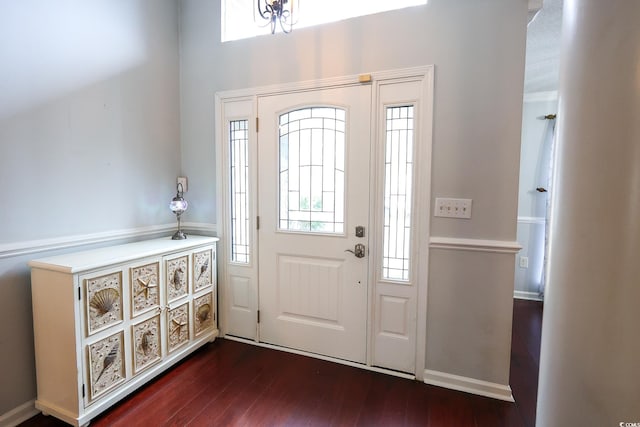 foyer entrance with dark hardwood / wood-style flooring