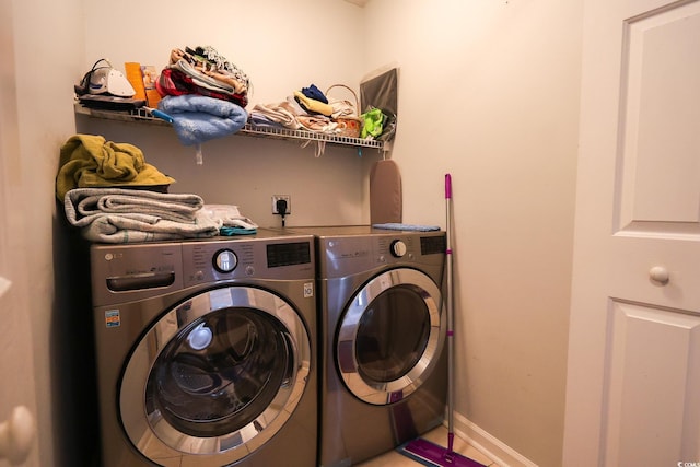 laundry room with washer and clothes dryer