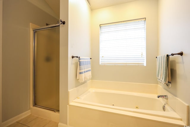 bathroom featuring tile patterned flooring and independent shower and bath