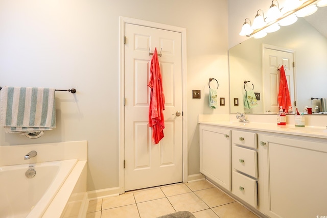 bathroom with tile patterned flooring, vanity, and a bathing tub