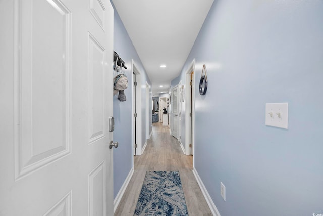 corridor featuring light hardwood / wood-style flooring