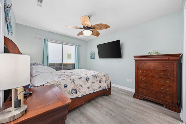 bedroom featuring ceiling fan and light hardwood / wood-style flooring