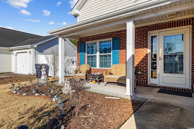 doorway to property featuring a garage and a porch