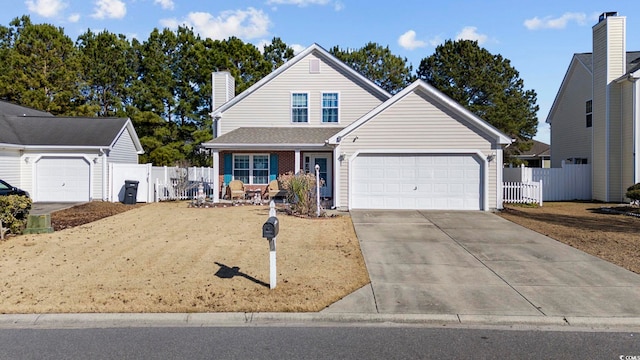 4821 Southgate Pkwy, Myrtle Beach, SC 29579 - traditional home featuring driveway, a chimney, an attached garage, and brick siding
