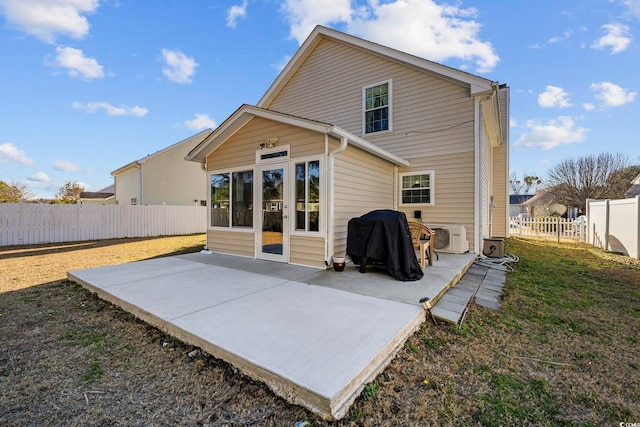 back of house with a patio