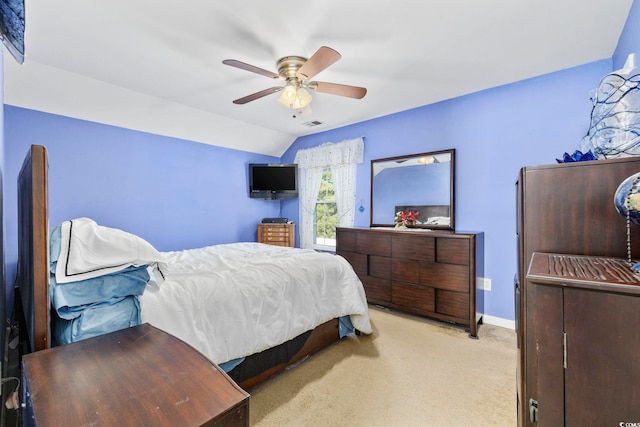 carpeted bedroom with ceiling fan and lofted ceiling