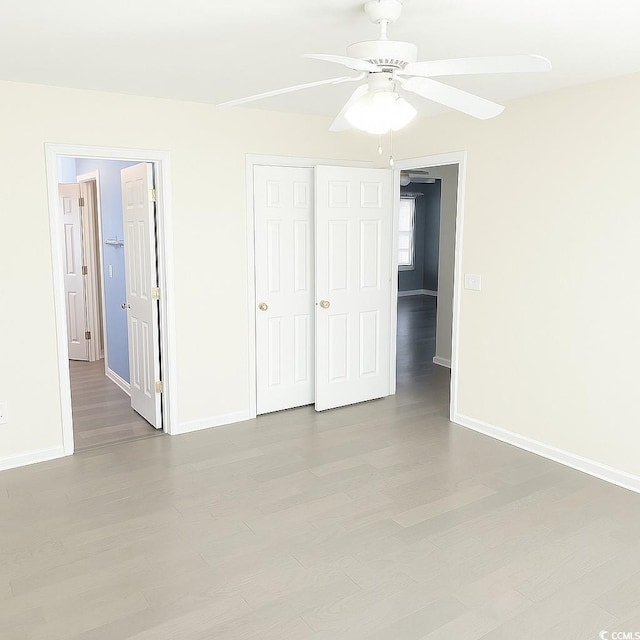 4821 Southgate Pkwy, Myrtle Beach, SC 29579 - unfurnished bedroom featuring baseboards, a closet, and wood finished floors