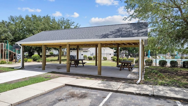 view of home's community with a playground, a gazebo, and a patio