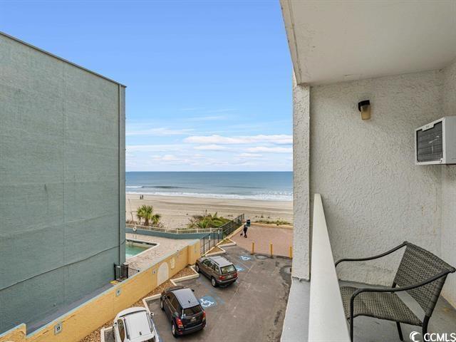 1205 S Ocean Blvd Unit 50412, Myrtle Beach, SC 29577 - balcony featuring view of water and beach and a wall mounted AC