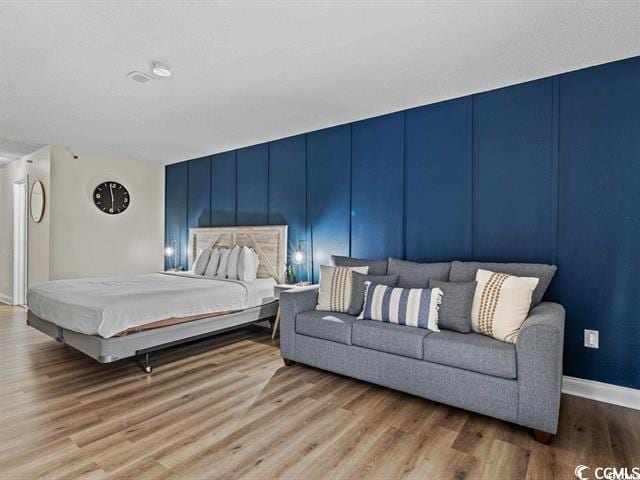 bedroom with light wood-type flooring