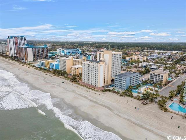 bird's eye view featuring a view of the beach and a water view