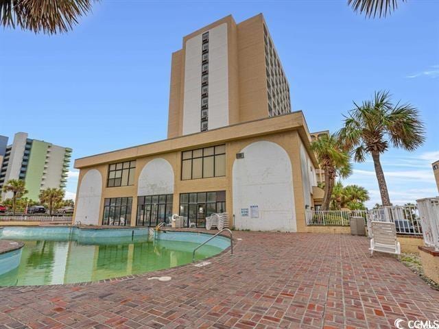 view of swimming pool with a patio area