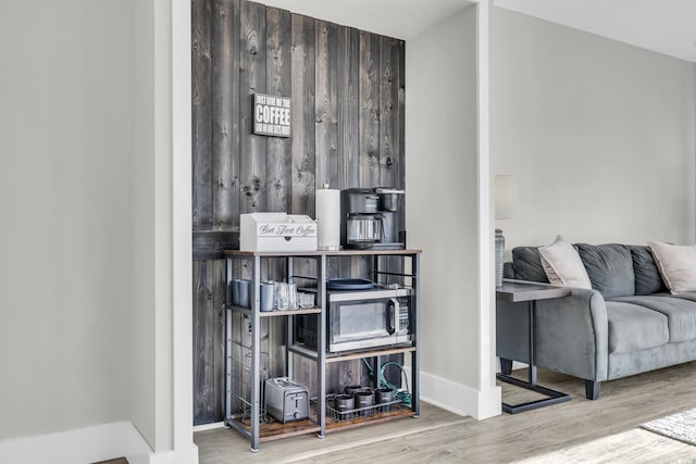 interior space featuring wood walls and wood-type flooring