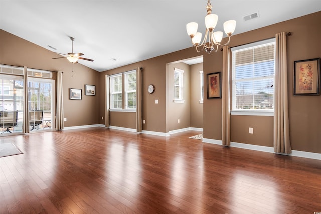 interior space with hardwood / wood-style flooring, ceiling fan with notable chandelier, and vaulted ceiling