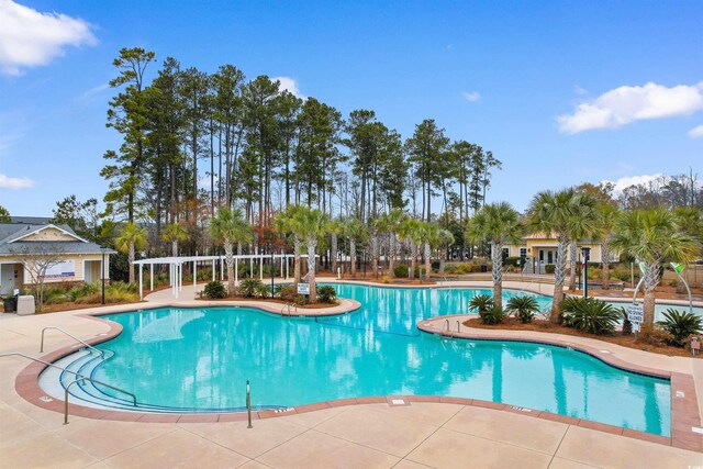 view of pool featuring a pergola and a patio