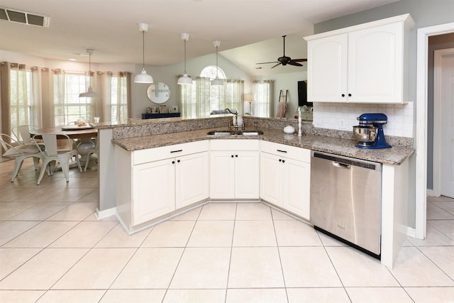 kitchen with white cabinetry, vaulted ceiling, dishwasher, and sink