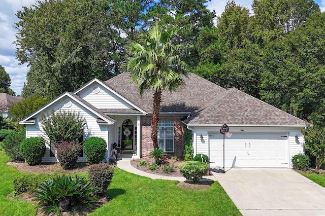 view of front facade with a garage and a front yard