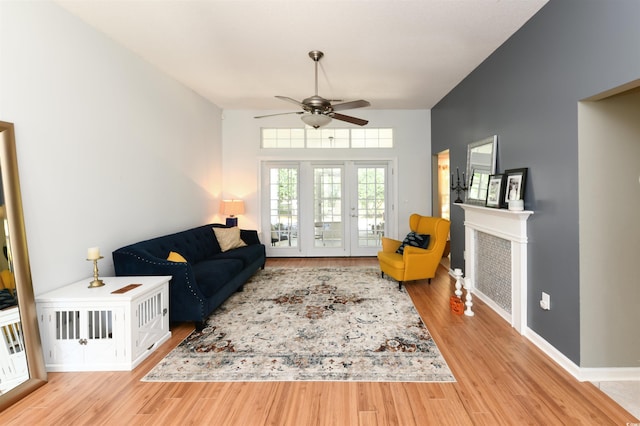 living room featuring hardwood / wood-style flooring and ceiling fan