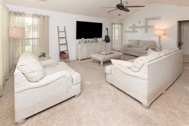 carpeted living room with vaulted ceiling and ceiling fan