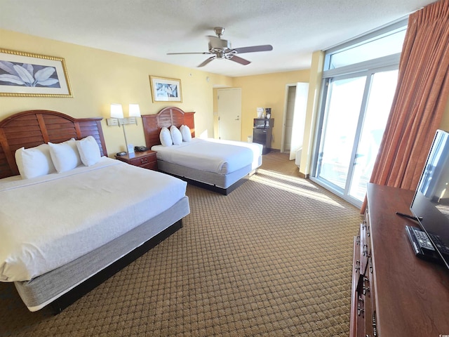 carpeted bedroom featuring access to outside and ceiling fan