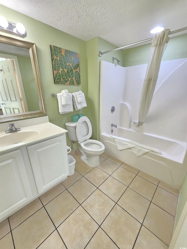 full bathroom with bathing tub / shower combination, tile patterned flooring, vanity, a textured ceiling, and toilet