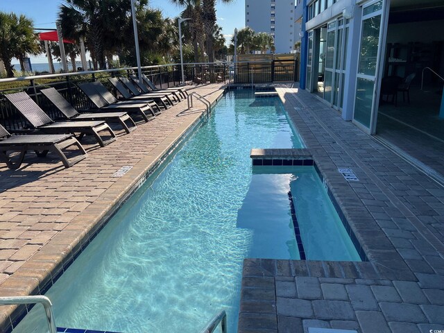 community pool with a patio